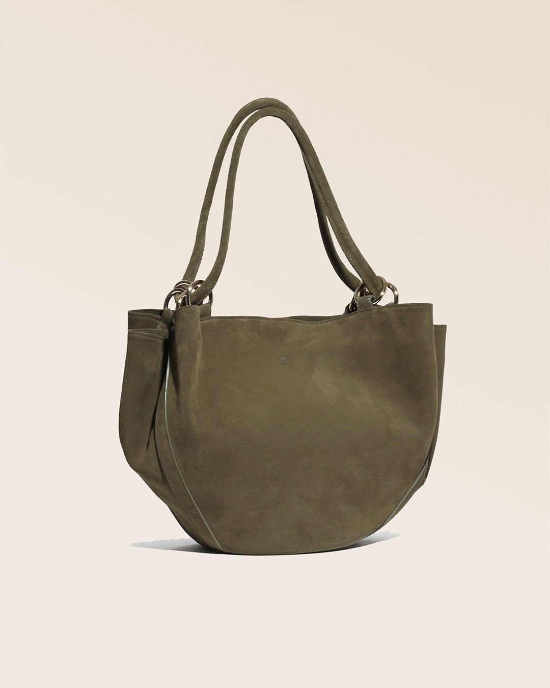 A quarter view of our Paita bag in truffle suede calf leather.