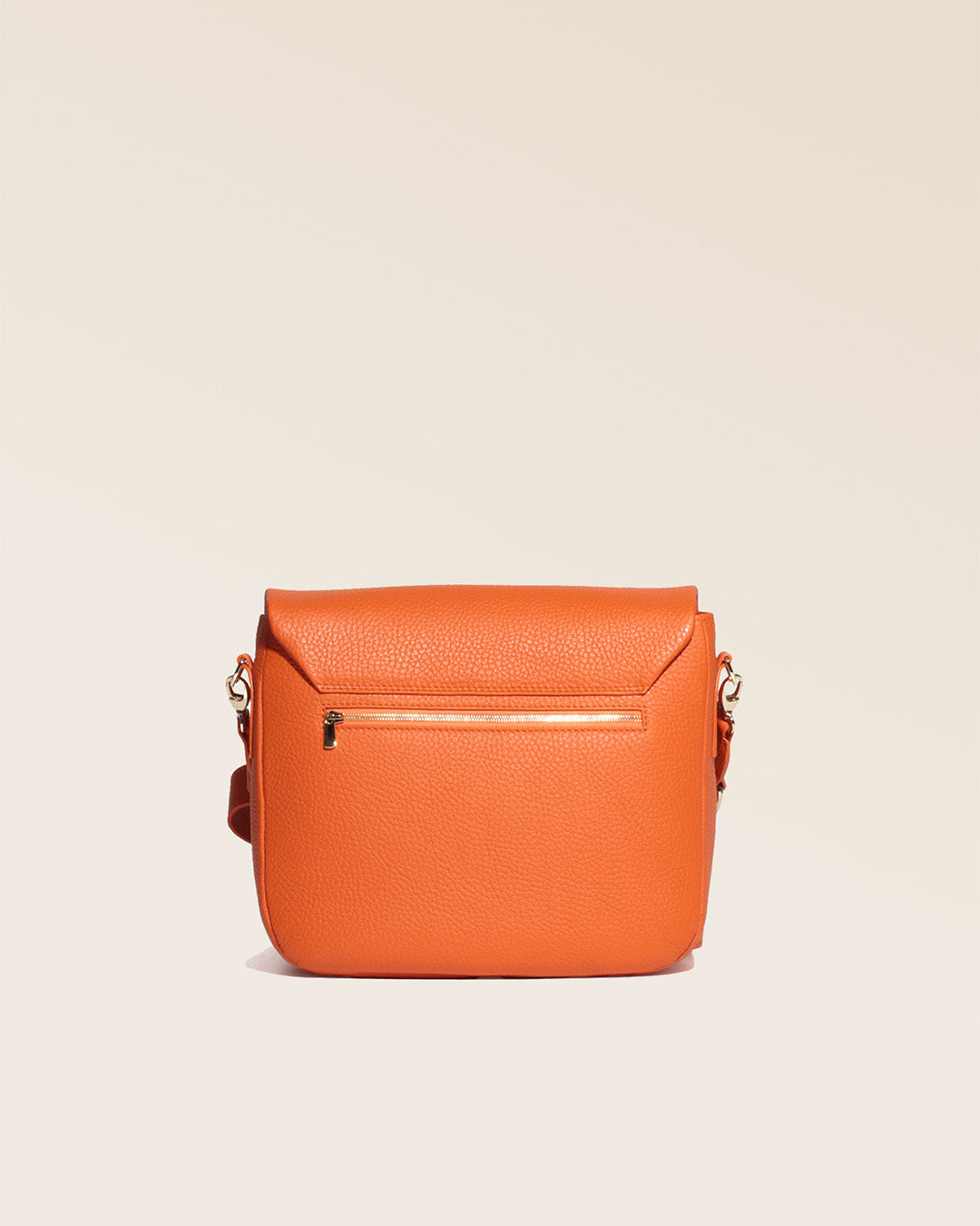 Our Samuel bag in orange vicuña-style leather, seen from the back in the studio.