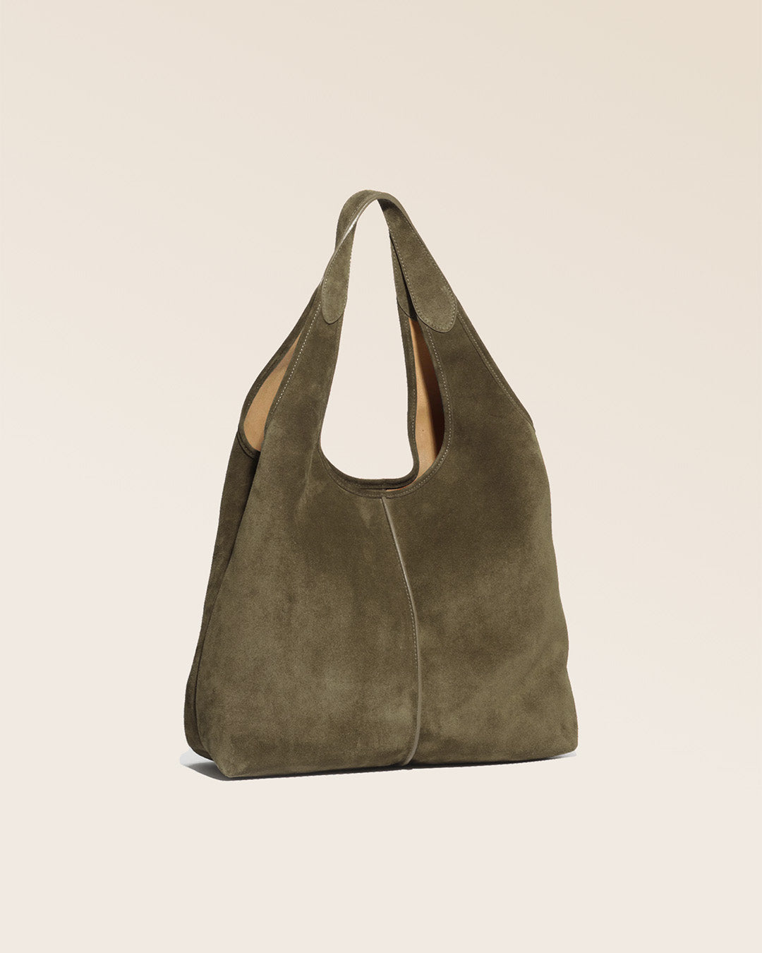 Our Valentine bag in truffle suede as seen from a quarter in the studio.