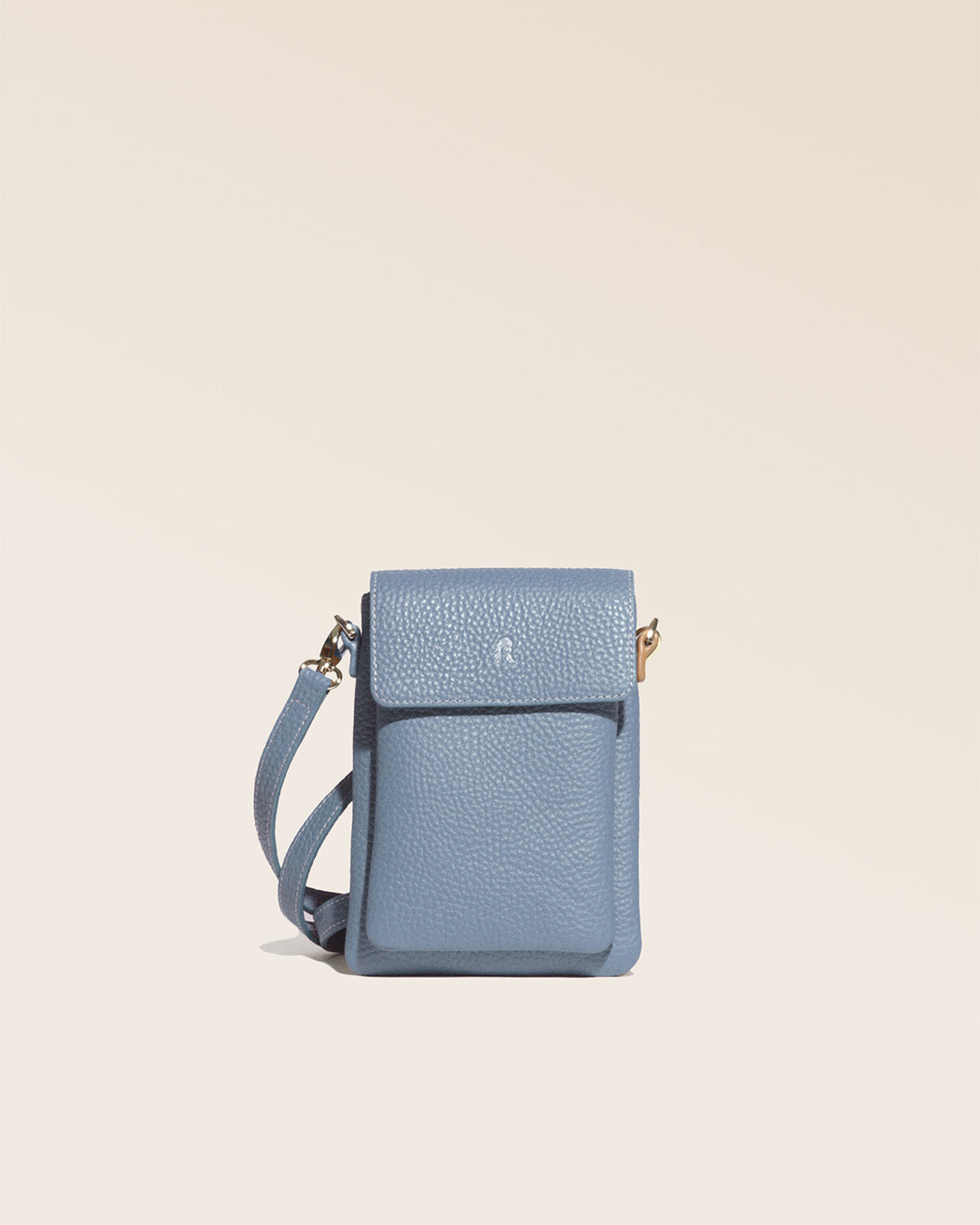 Our Gull clutch bag in cobalt-blue vicuña-style leather, seen from the front in the studio.