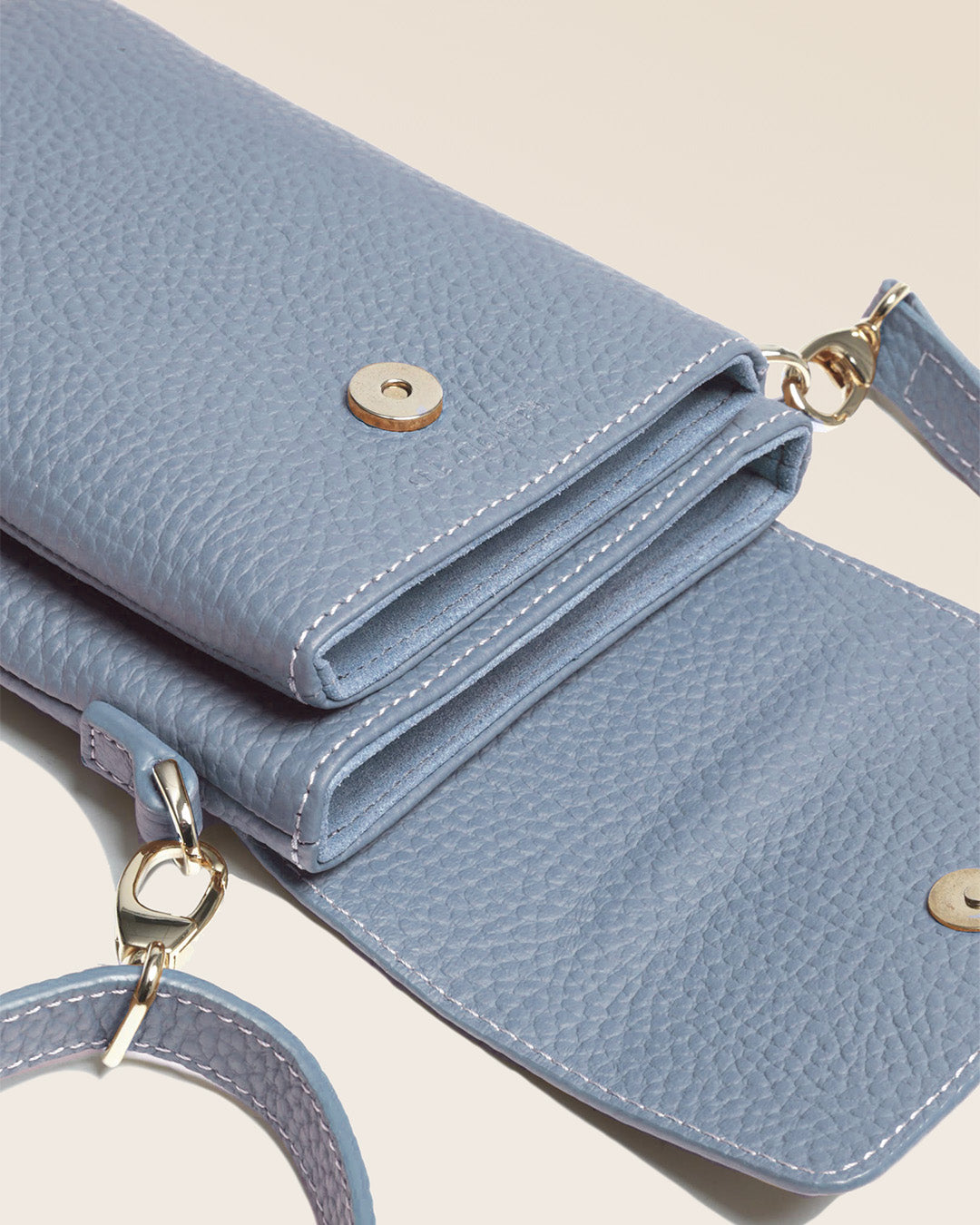 Our Gull clutch bag in cobalt-blue vicuña-style leather, seen up close in the studio.