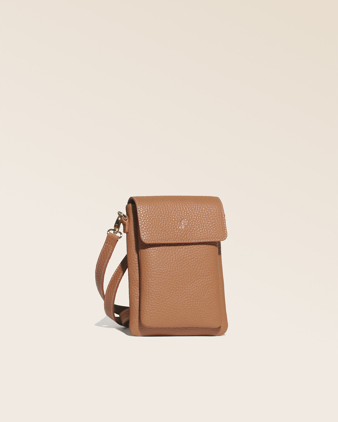 Our Gull clutch bag in fawn-colored vicuña leather, seen from the studio.