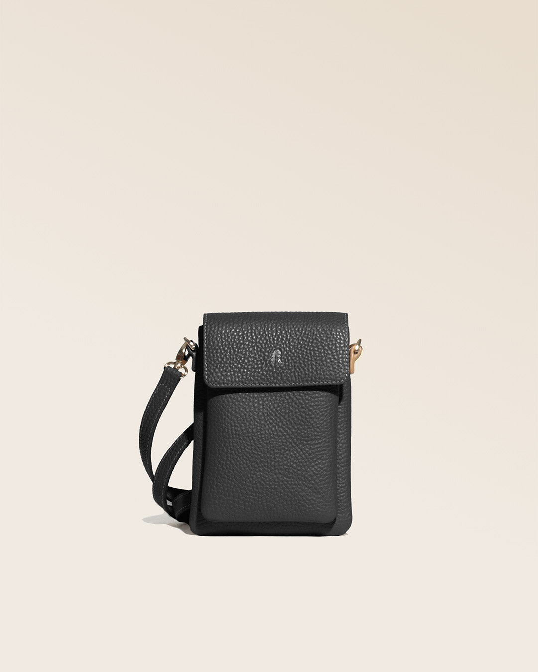 Our Gull clutch bag in black vicuña-style leather, seen from the front in the studio.