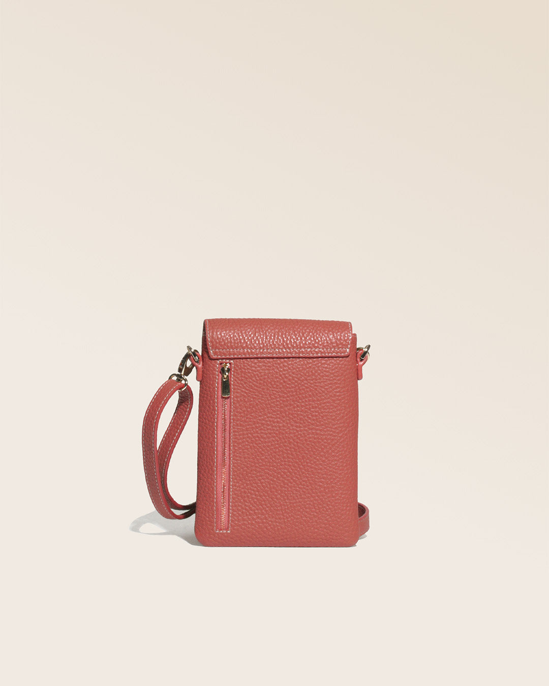 Our Renouard seagull clutch bag in terracotta vicuña-style leather, seen from the back in the studio.