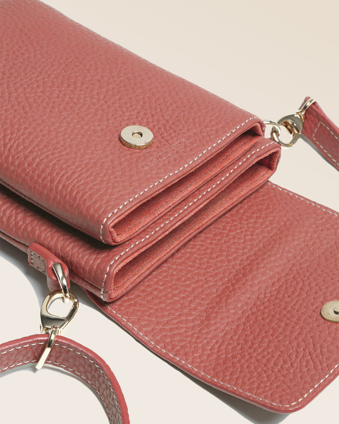 Our Renouard seagull clutch bag in terracotta vicuña-style leather, seen from above in the studio.