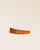 La ceinture Célia Renouard, en cuir façon vigogne orange et boucle laiton vieilli, vue de face en studio.
