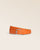 La ceinture Hugo Renouard en cuir façon vigogne orange, vue de face en studio.