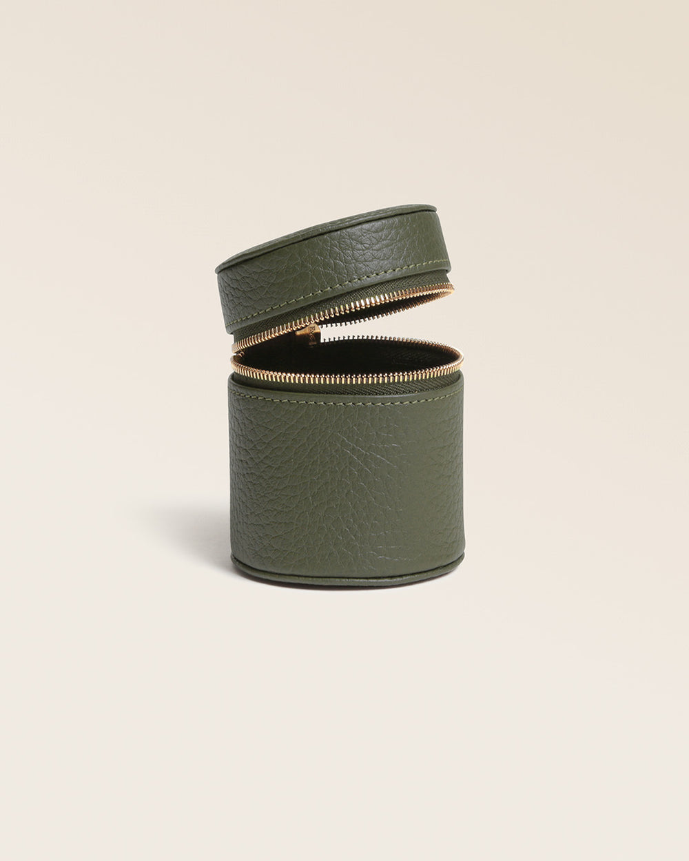 Our Renouard ring box in khaki vicuña-style leather, seen from the side, open in the studio.