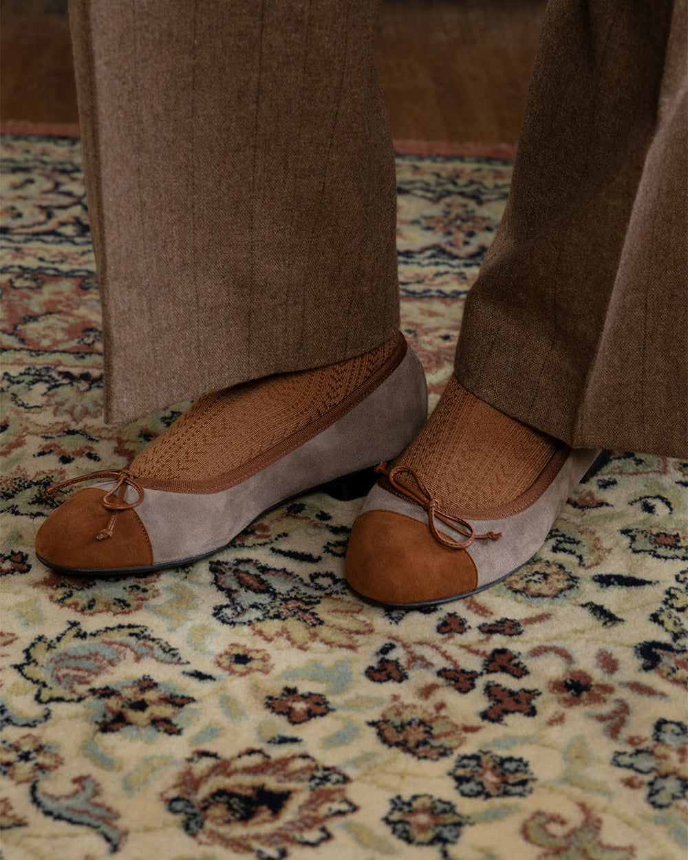 Our Friandise Renouard ballerinas in taupe and fawn nubuck leather, seen worn by our model.