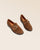 Nos mocassins Mascotte Renouard en cuir nubuck fauve, vus en studio.