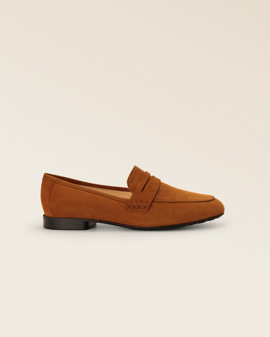 Our Paros Renouard loafers in tan nubuck leather, seen from the side in the studio.