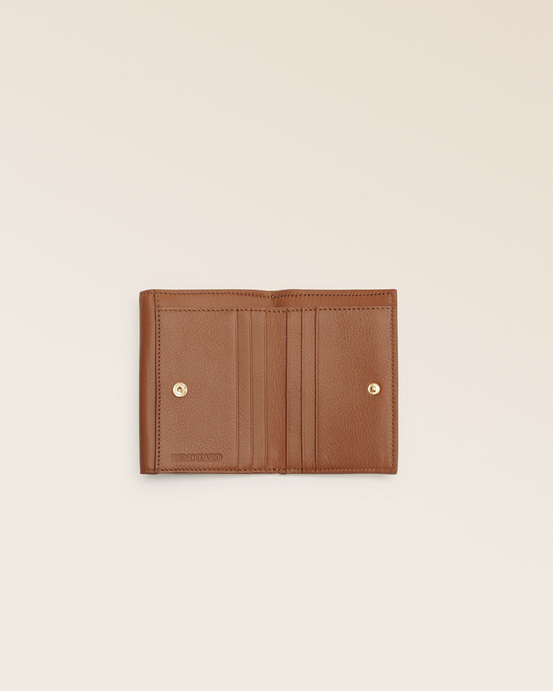 Notre porte-monnaie Ariana Renouard en cuir vintage camel vu du dessus en studio.