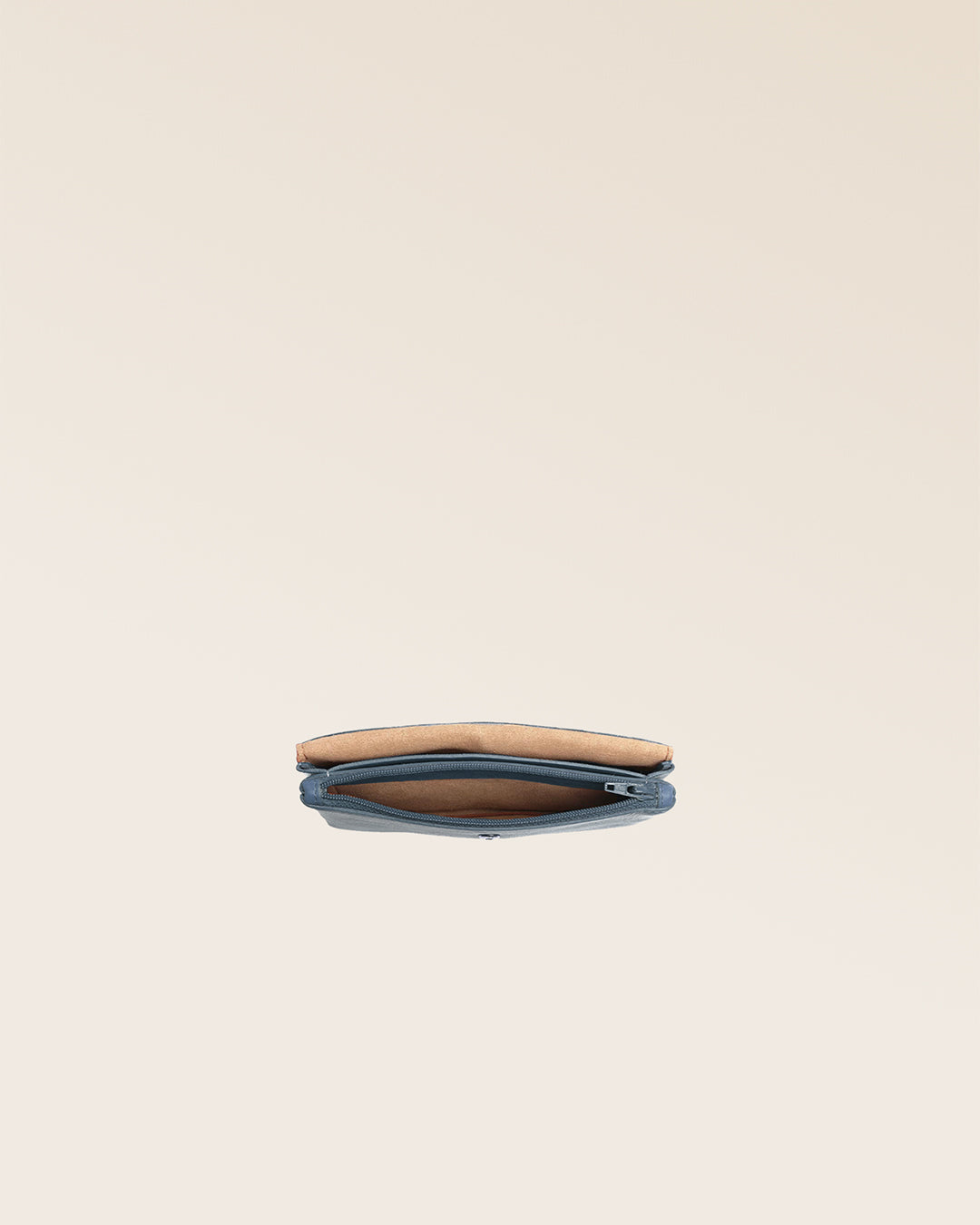 Our Lilou Renouard wallet in vintage denim seen from above in the studio.