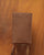 Our Renouard phone pouch in fawn-colored vicuña leather, seen from the front in ambience.