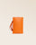 Notre pochette téléphone Renouard en cuir façon vigogne orange vue de face en studio.