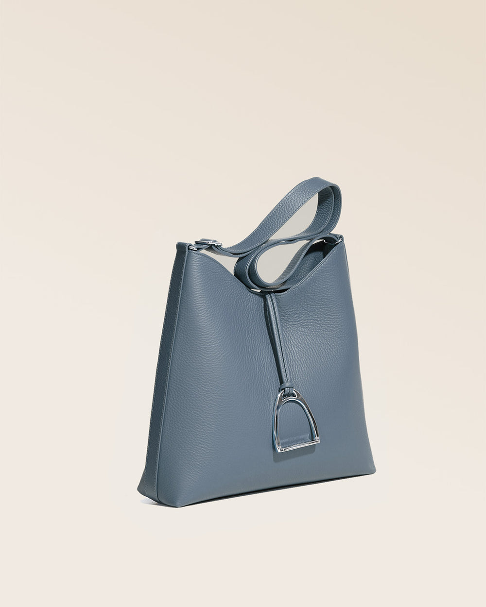 Our Cob Renouard bag, in its large version, in cobalt-blue vicuña-style leather and leather shoulder strap, seen from the quarter in the studio.