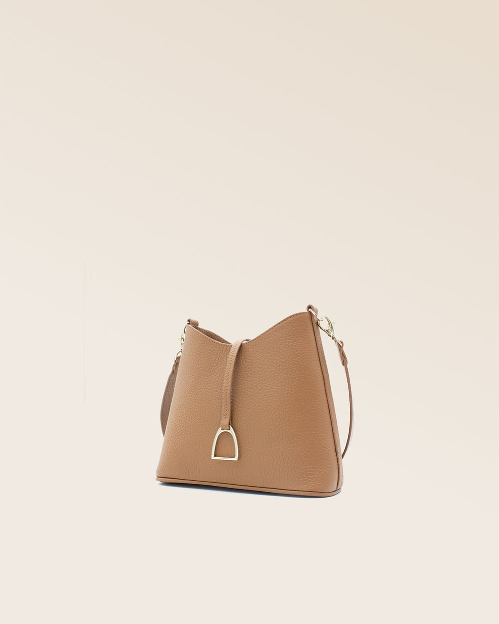 A quarter view of our Mini Cob bag in fawn-colored vicuña leather.
