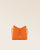 Notre sac Mini Cob en cuir façon vigogne orange vu de face en studio.
