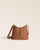 Notre sac Cob Renouard dans sa version Mini modèle, en cuir vintage camel et bandoulière cuir ; vu de face en studio.