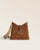 Notre sac Cob Renouard dans sa version petit modèle, cuir veau velours noisette et bandoulière coton camel ; vu de face en studio.