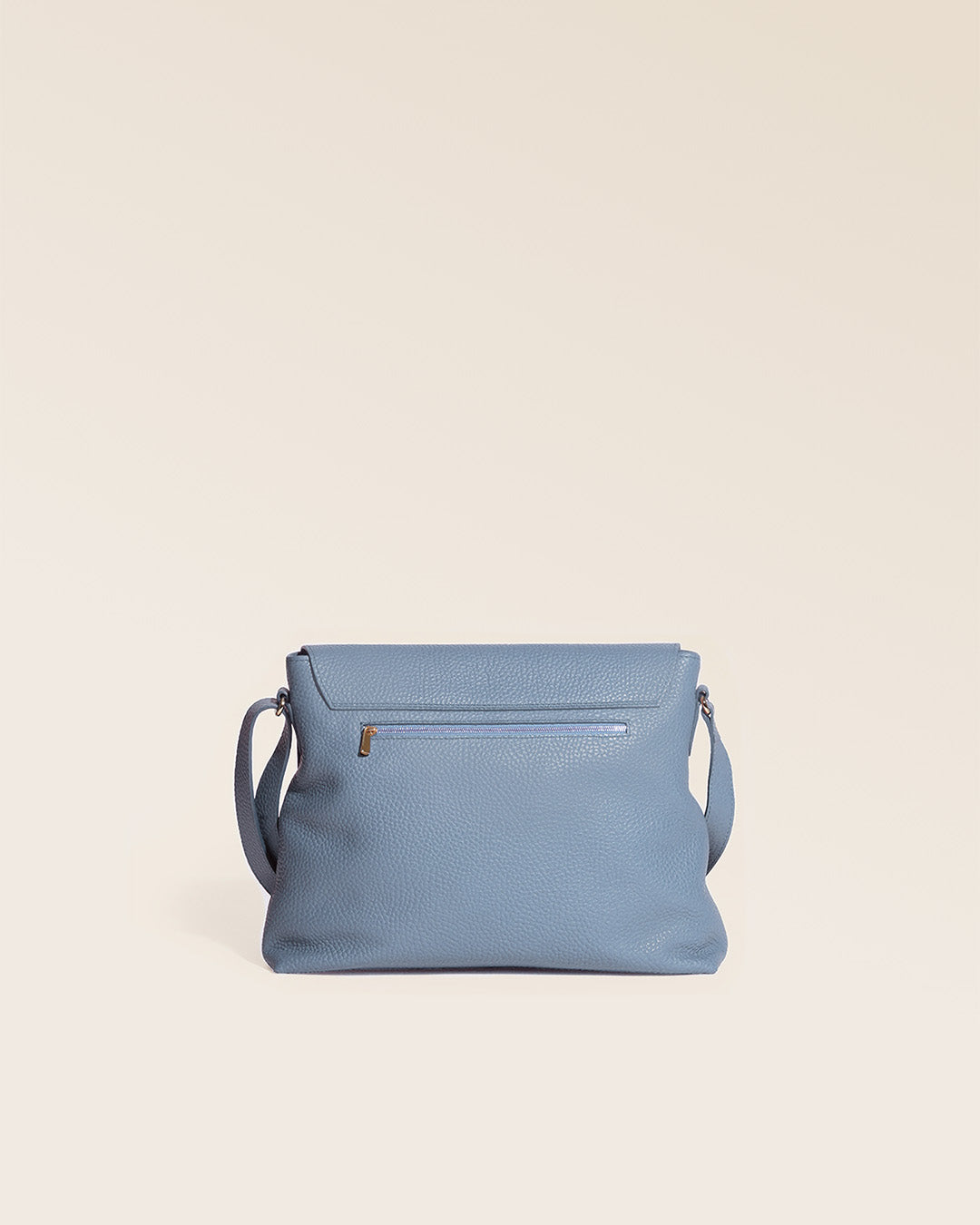 Our Gwenn bag in cobalt-blue vicuña-style leather, seen from the back in the studio.