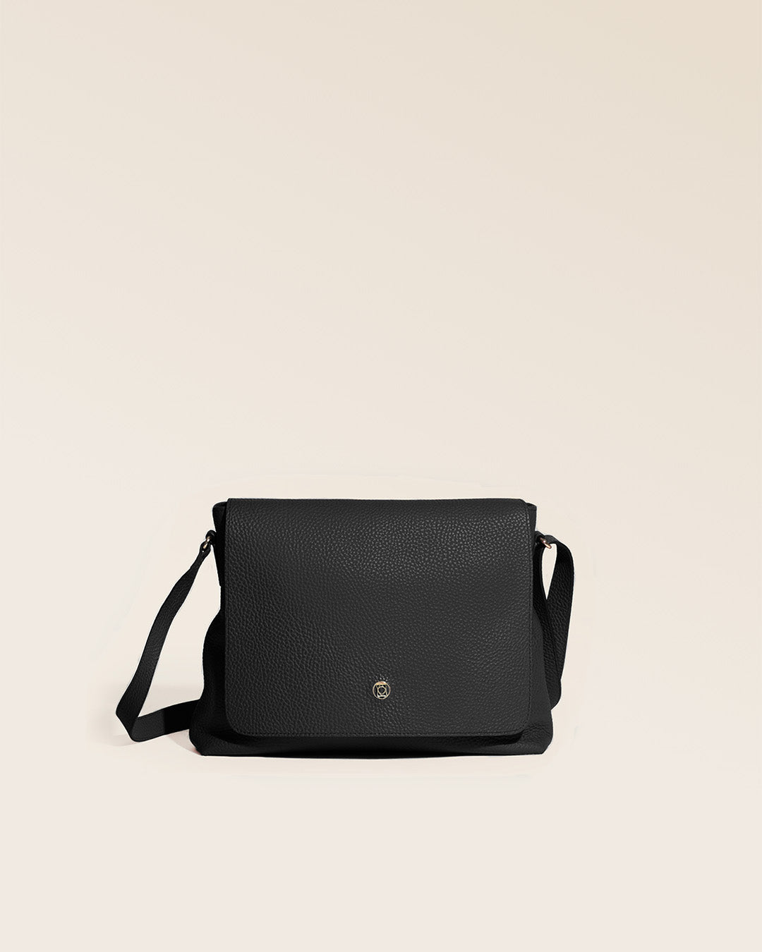 Our Gwenn bag in black vicuña-style leather, seen from the front in the studio.