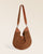 Notre sac Marius Renouard en cuir veau velours noisette vu de face en studio.