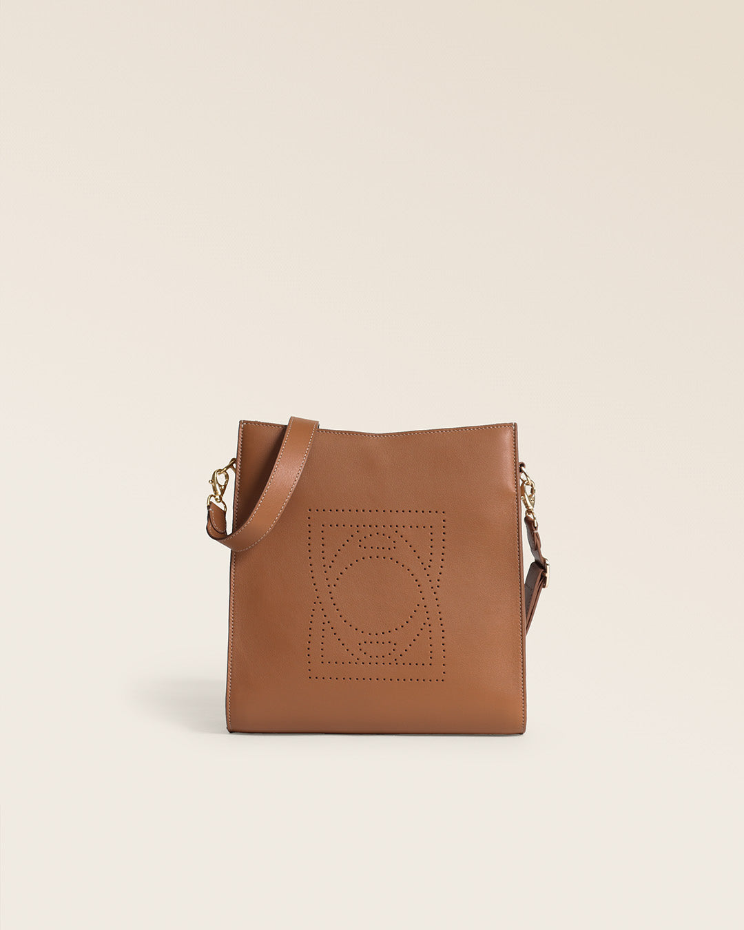 Le sac Mini Étrivière Renouard en cuir lisse camel et bandoulière cuir, vu de face en studio.