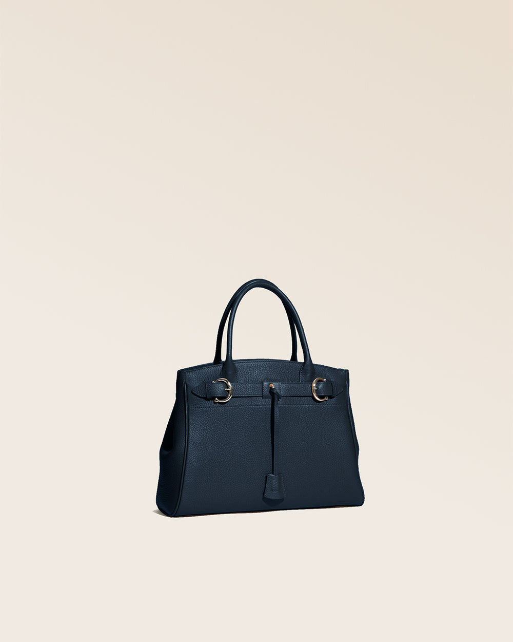 Our Prestige Renouard bag, in its Mini version, in navy vicuña-style leather, seen from the quarter in the studio.