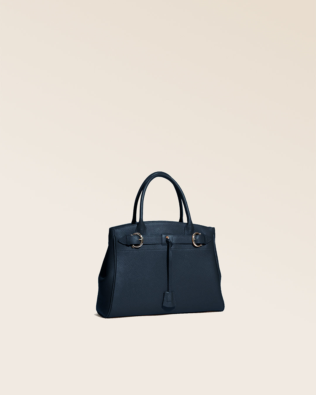 Our Prestige Renouard bag, in its Mini version, in navy vicuña-style leather, seen from the quarter in the studio.