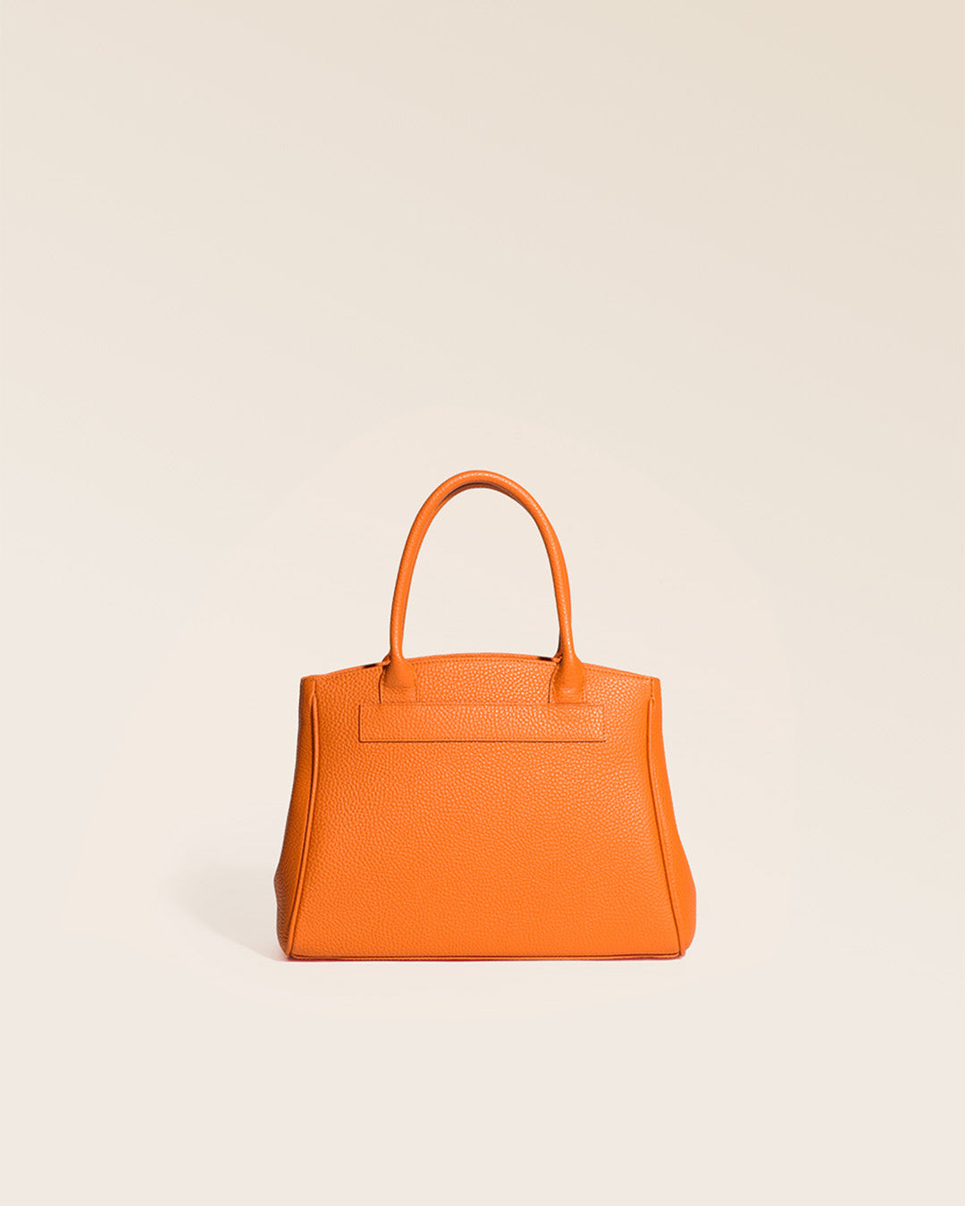 Our Prestige Renouard bag, in its Mini version, in orange vicuña-style leather, seen from the back in the studio.