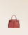 Our Prestige Renouard bag, in its Mini version, in terracotta vicuña-style leather, seen from the front in the studio.