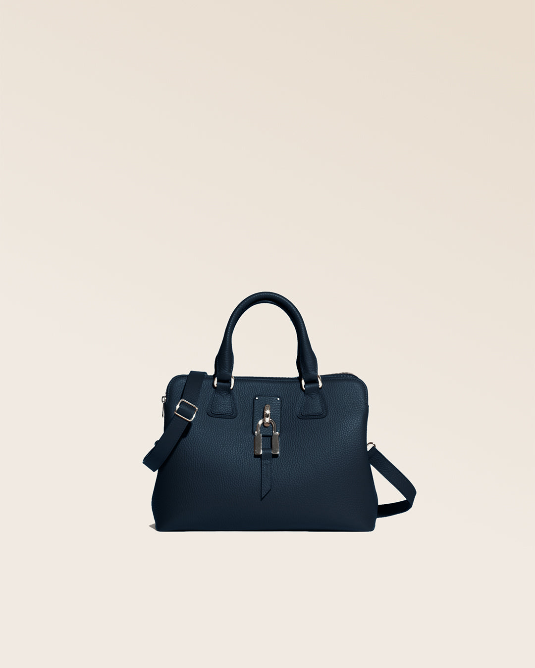 Our Renouard New-York bag, in its Mini version, with navy blue vicuña-style leather and gold accessories, seen from the front in the studio.