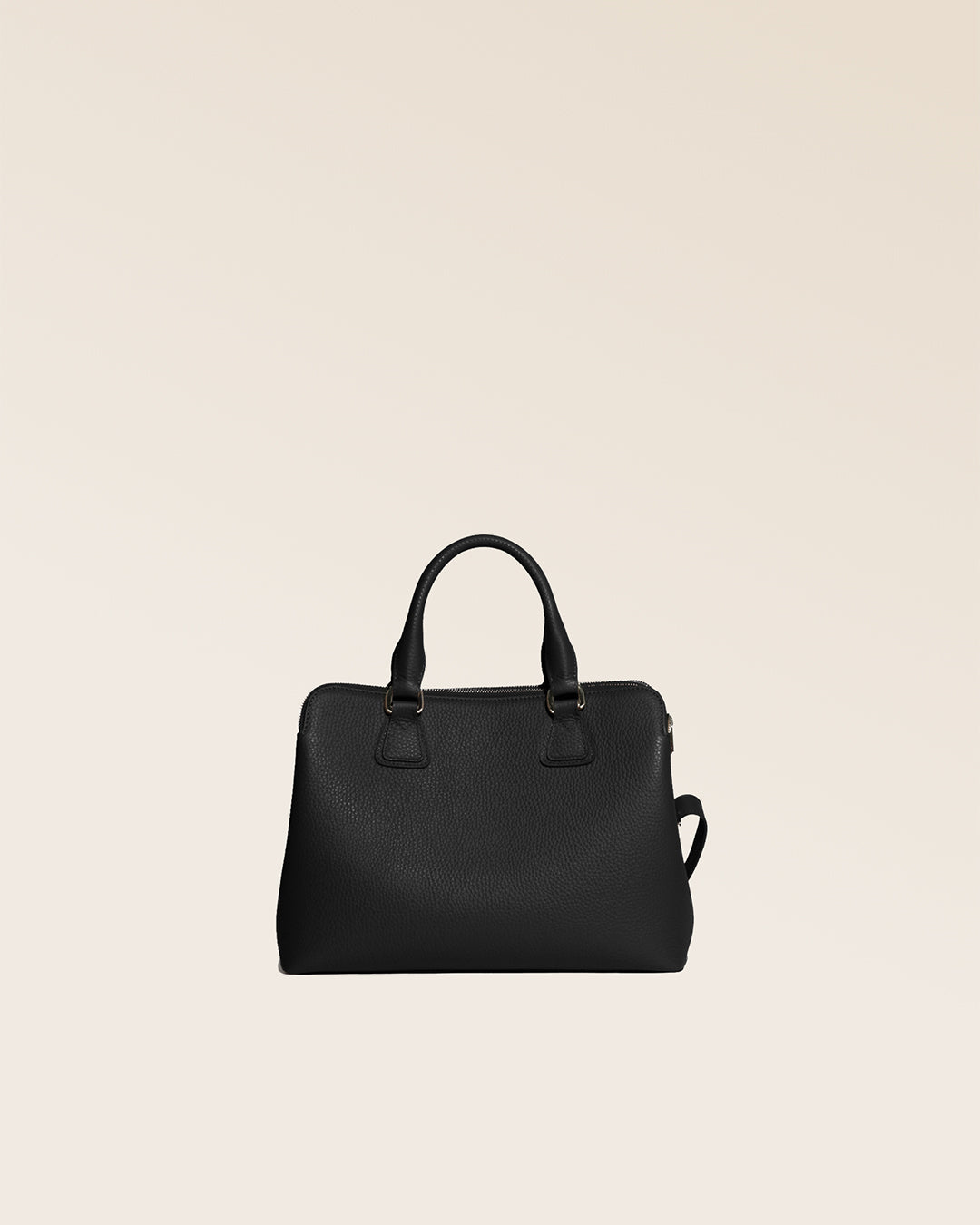 Our Renouard New-York bag, in its Mini version, in black vicuña-style leather, seen from behind in the studio.