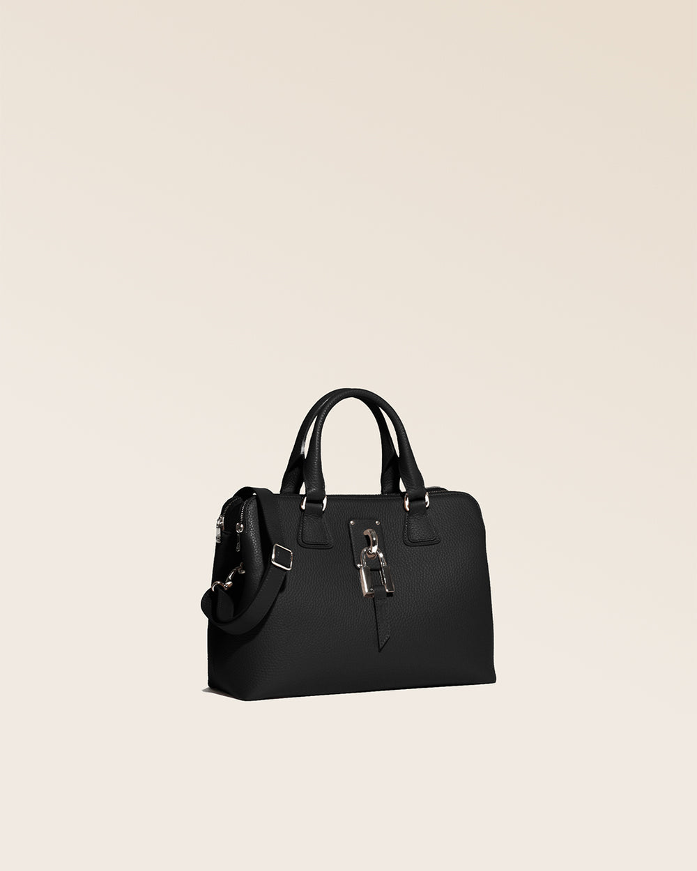 Our Renouard New-York bag, in its Mini version, in black vicuña-style leather, seen from the quarter in the studio.