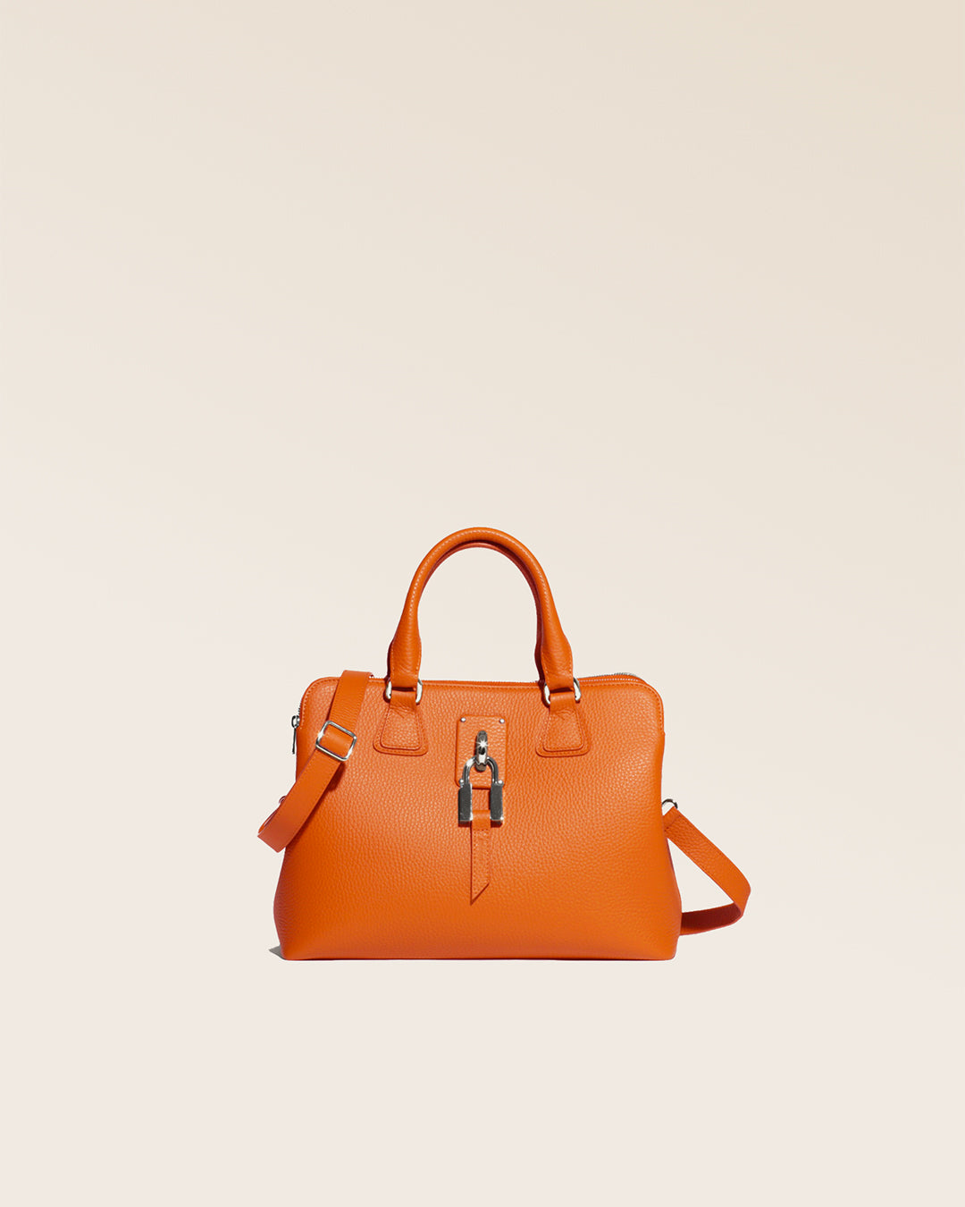 Our Renouard New-York bag, in its Mini version, in orange vicuña-style leather, seen from the front in the studio.