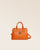 Our Renouard New-York bag, in its Mini version, in orange vicuña-style leather, seen from the front in the studio.