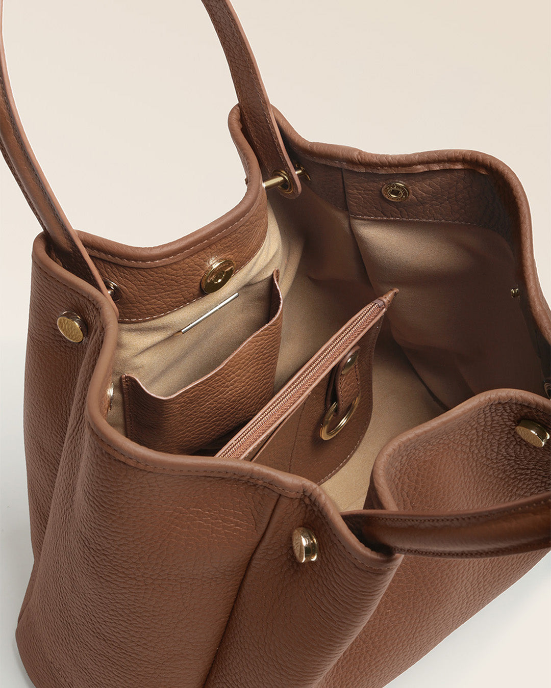 Our Saturn Renouard bag in fawn-colored vicuña leather, seen open in the studio.