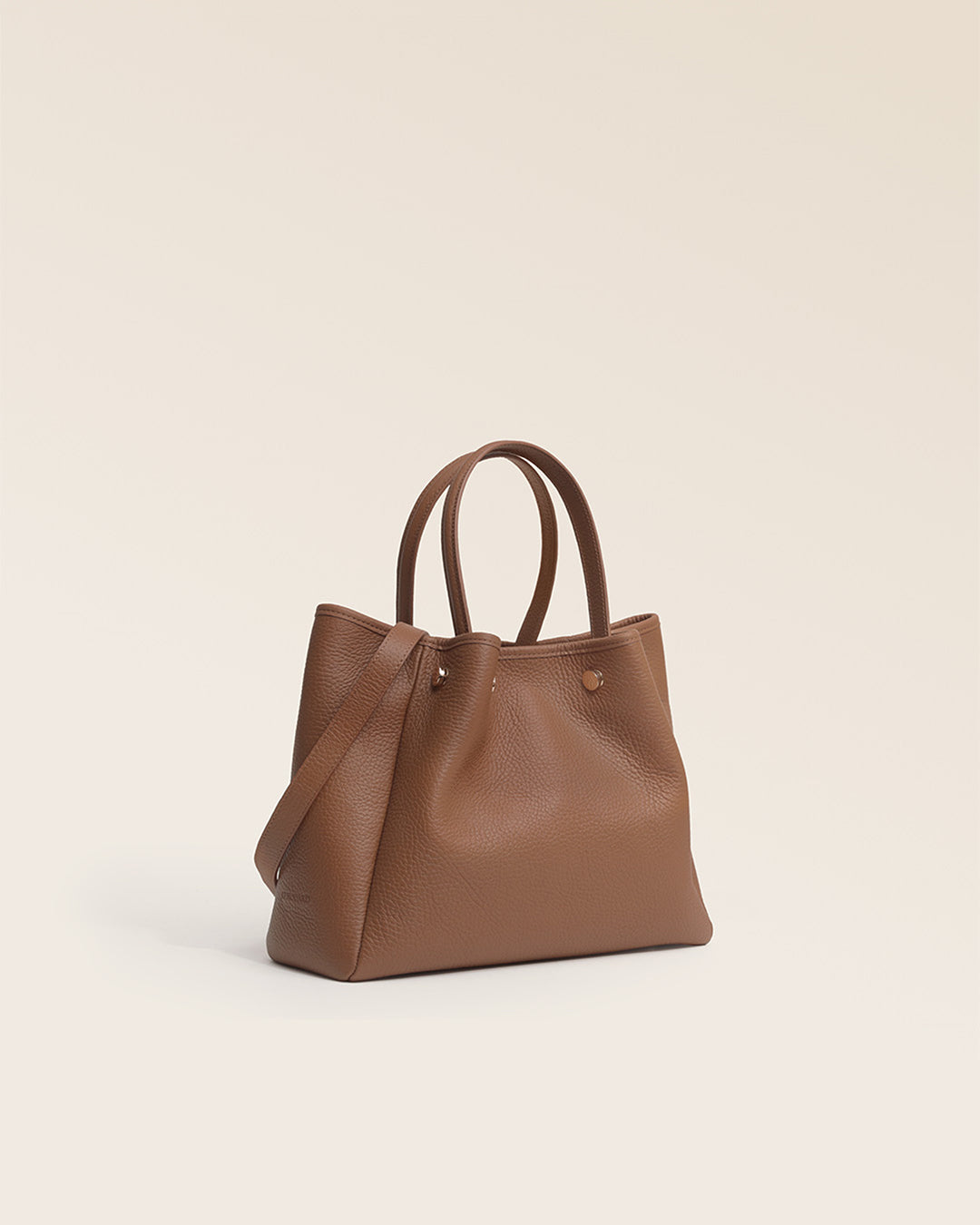 Our Renouard Saturn bag in fawn-colored vicuña leather, seen from the quarter in the studio.