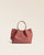 Le sac Saturne Renouard en cuir façon vigogne terracotta, vu de face en studio.