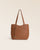 Notre sac Soline Renouard en cuir façon vintage camel vu de face dans notre studio.