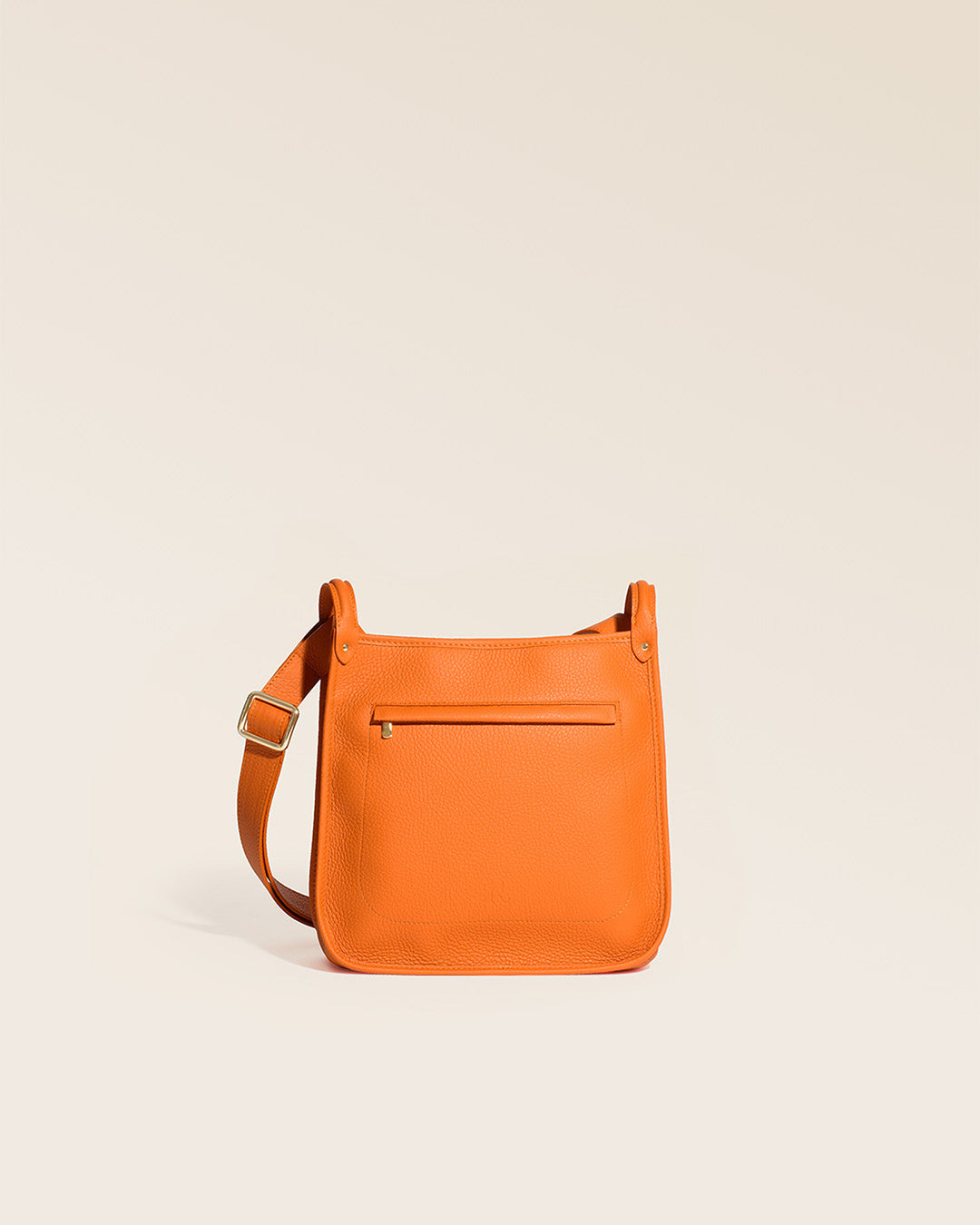 Our Stan bag in orange vicuña-style leather, seen from the front in the studio.